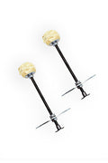 Two-rod fire torch with round crumpled yellow grips and black metal handles