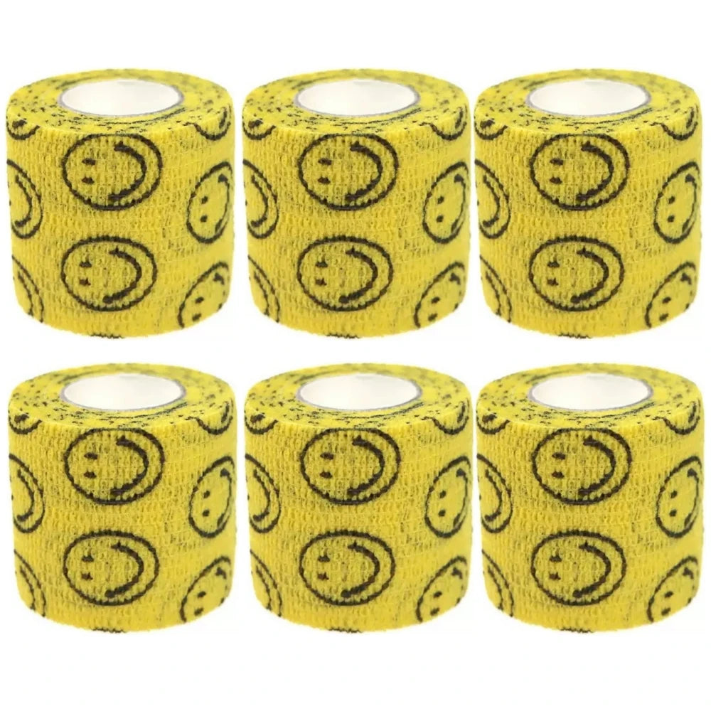 Set of yellow self-adhesive wrist bandage rolls with smiley-face icons