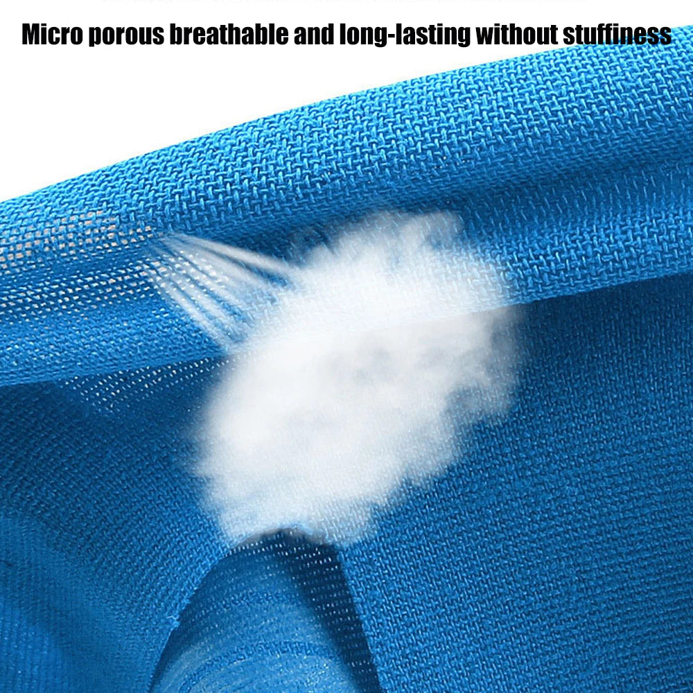 Blue kinesiology tape close-up showing porous fabric texture and adhesive layer