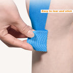 Blue precut kinesiology tape knee strips, hands applying to a leg