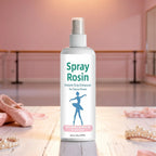 White rosin grip spray bottle with pump, shown with pale ballet shoes and beads