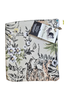 White floral-and-leaf printed cloth gear bag with drawstring and fabric loop pull